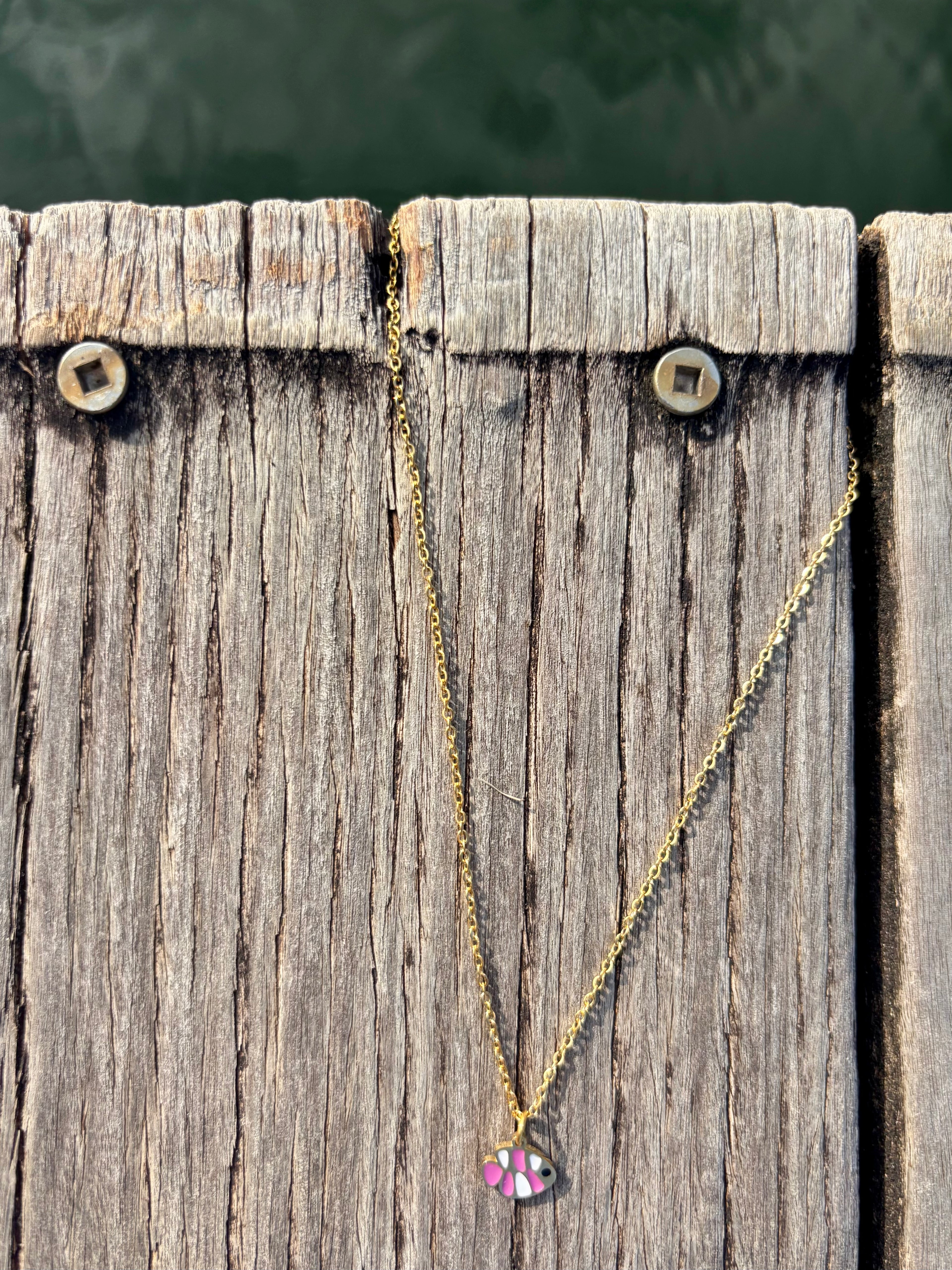 pink fish necklace