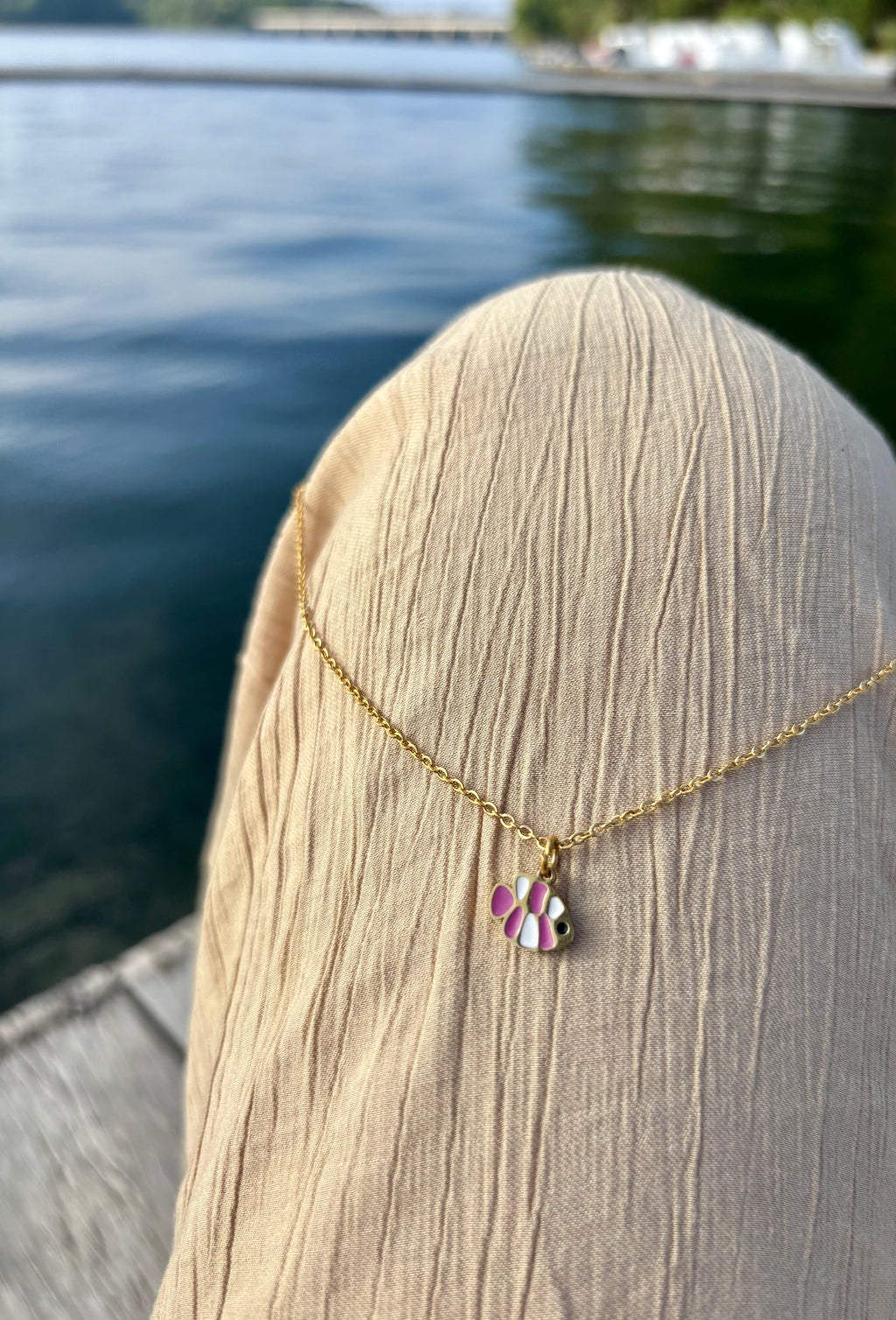 pink fish necklace