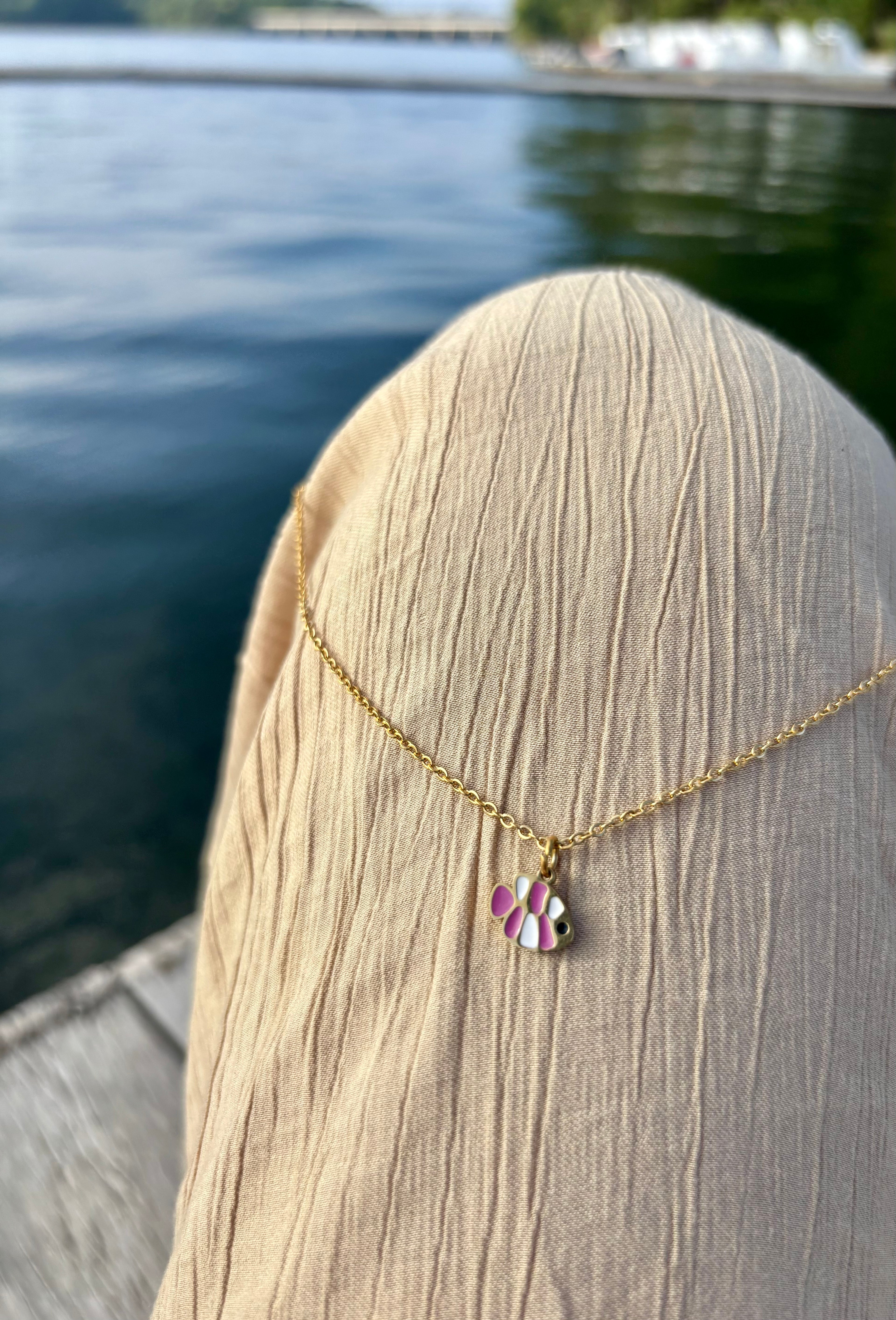 pink fish necklace