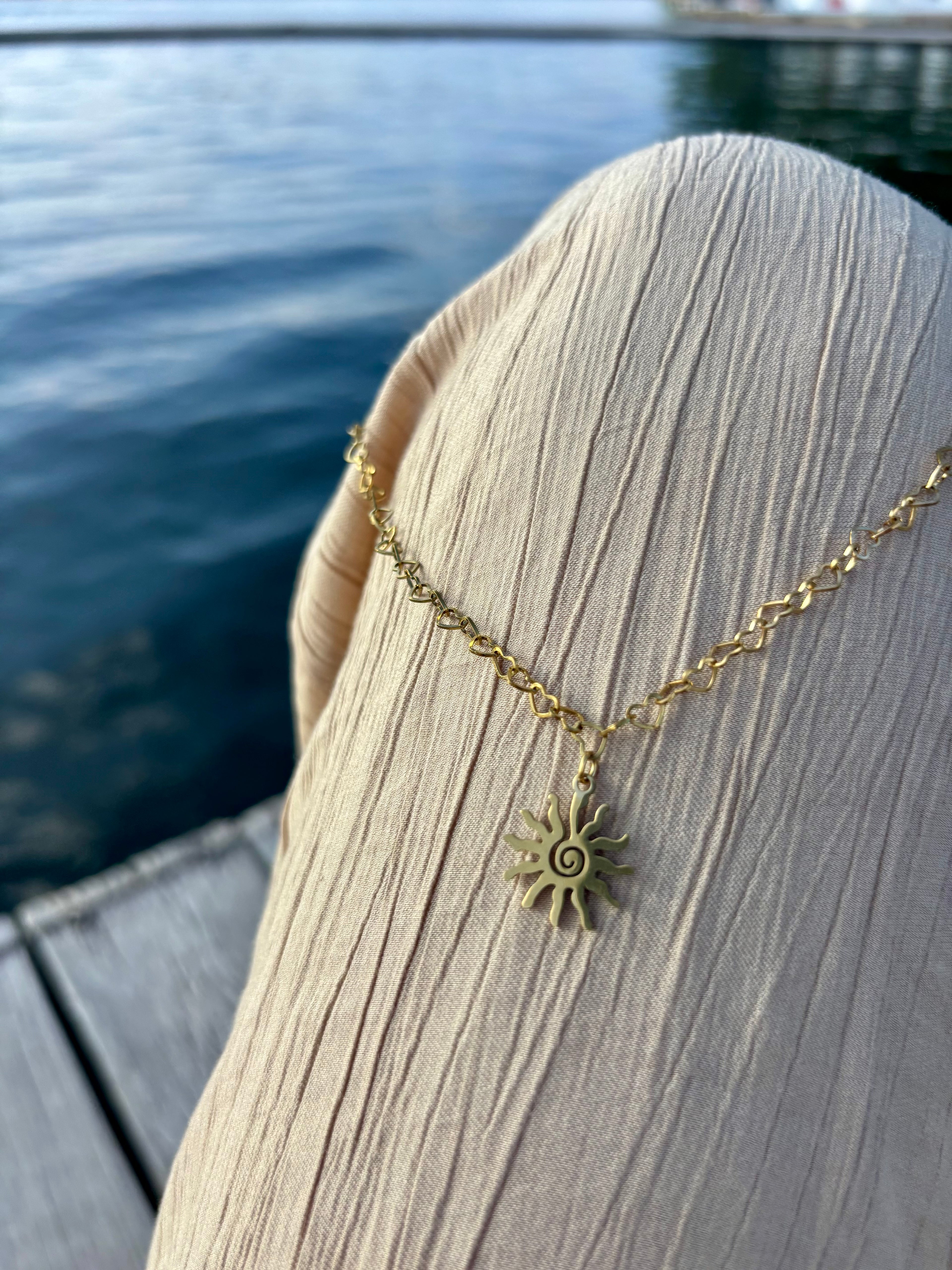 sunburst heart linked chain