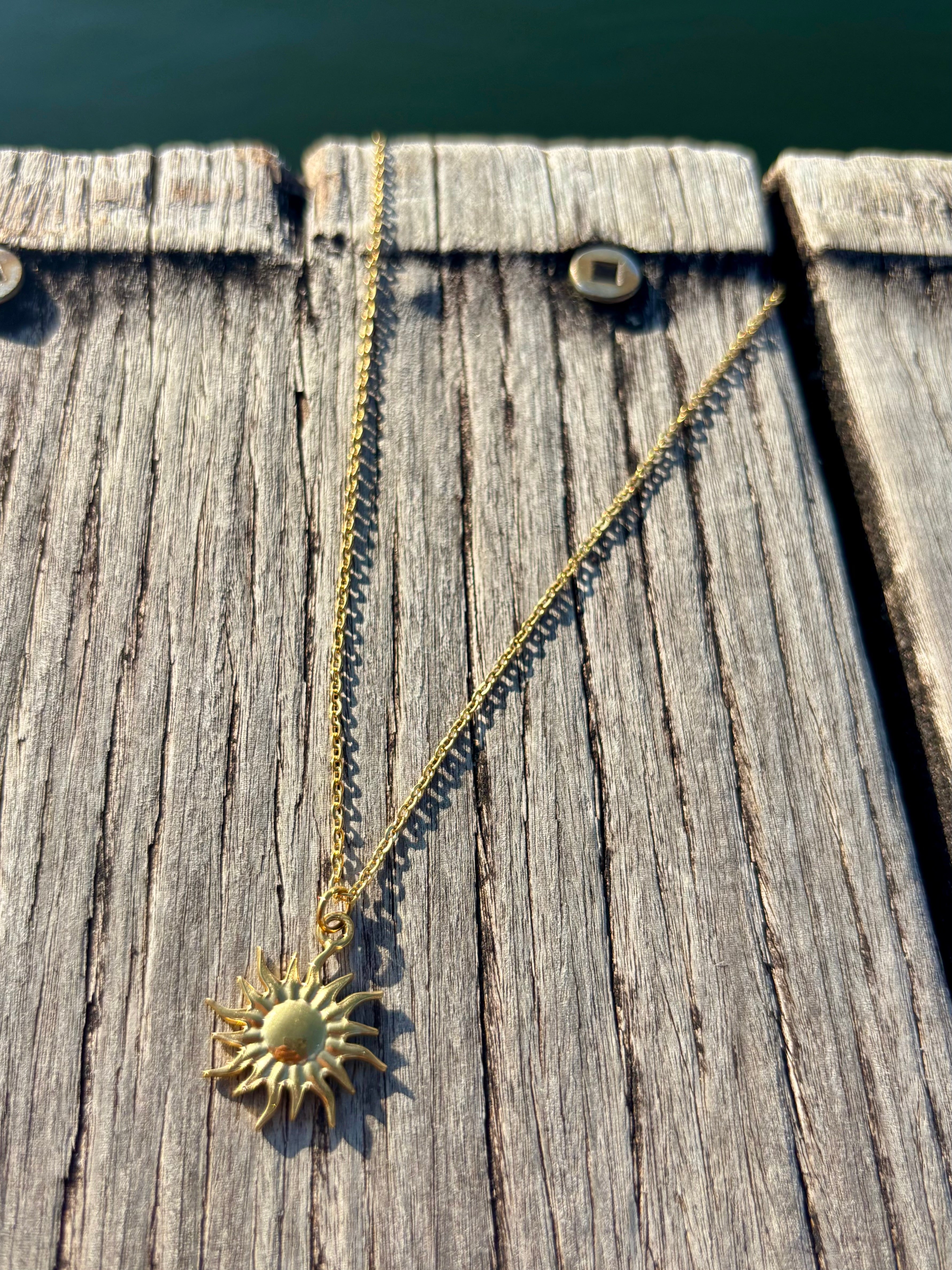 sunburst charm necklace
